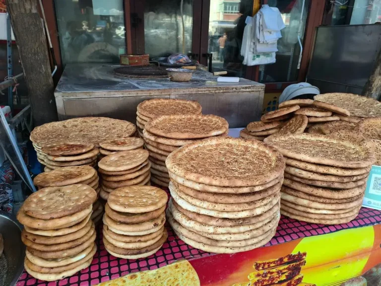 Naan (馕): Xinjiang’s Essential Flatbread — A Complete Guide