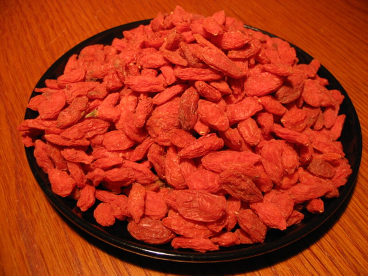 A plate of dried red goji berries ready to snack on or steep in tea