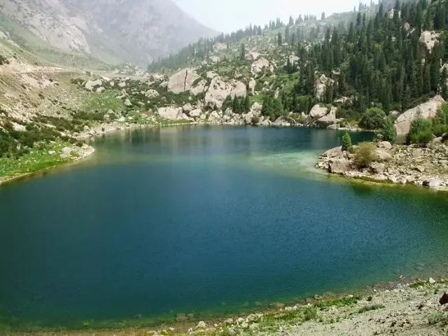 Alpine lake break on a long Xinjiang self-drive route